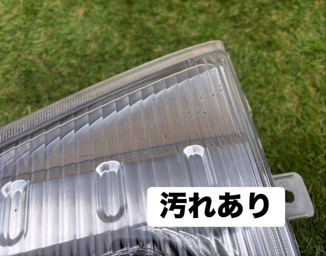 いすゞ エルフ 左ヘッドライト KOITO 110-21885