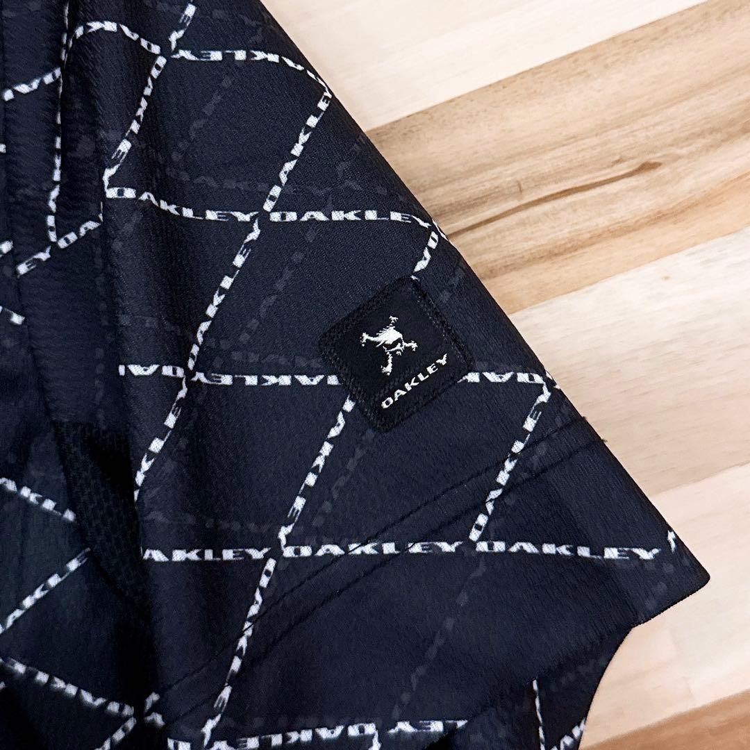 美品/廃番【オークリー】ゴルフ スカル ロゴ 半袖ポロシャツ 総柄 M 黒×白