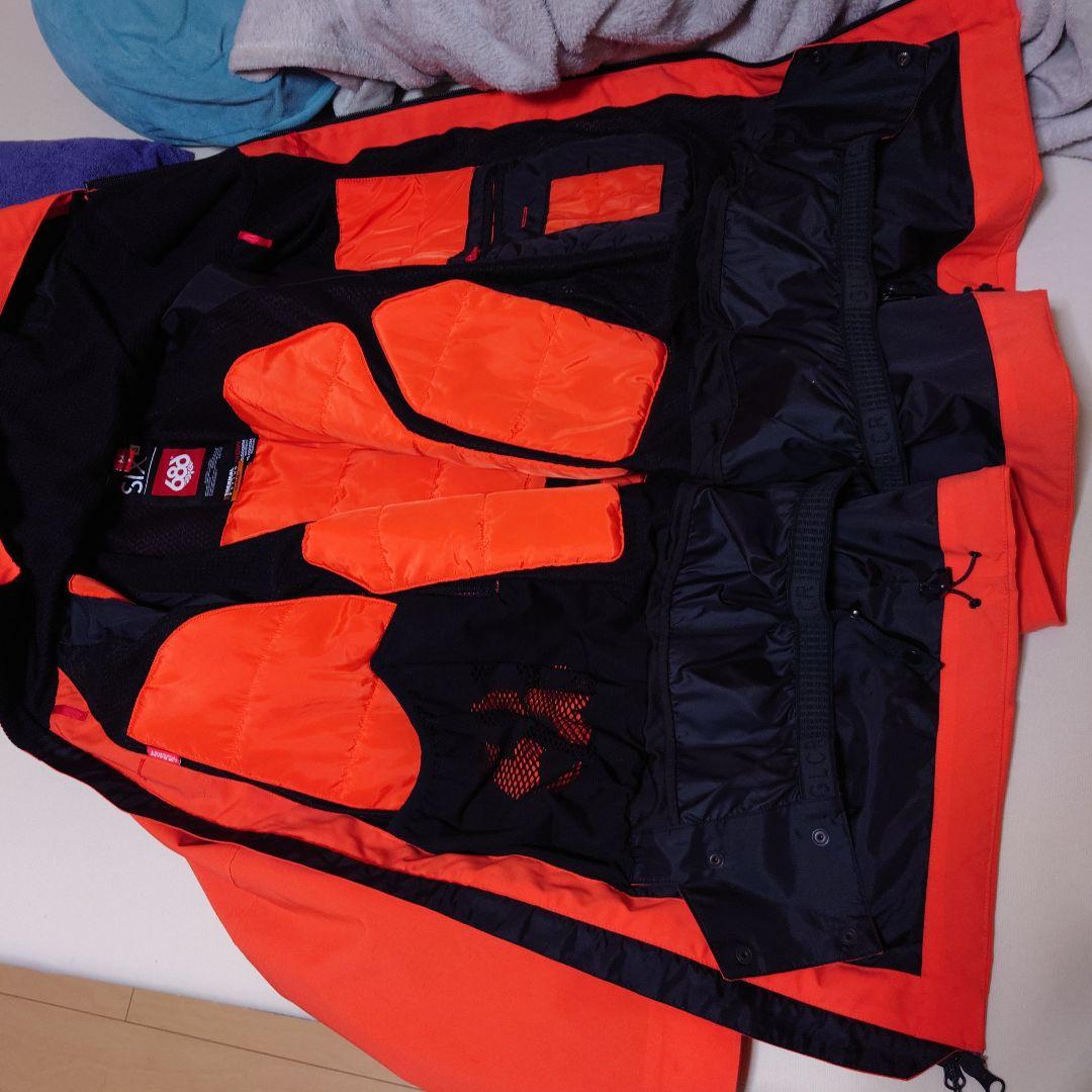 686限定ウェアです。 スノーボードジャケット M オレンジ　レア品